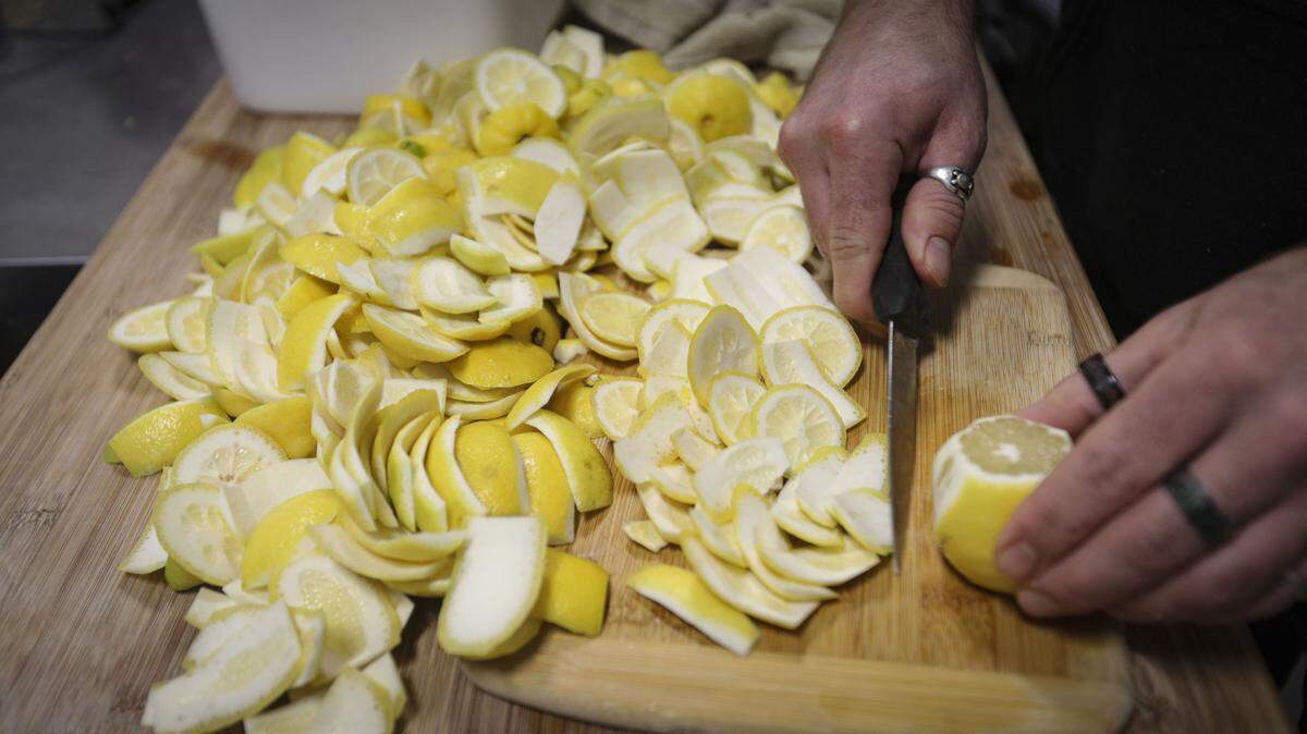 Hansen Steiger peals lemons. Fruit will be juiced and the rind will become goat food. RAD juice offers cold-pressed organic juices, fresh and available for delivery or at local Farmer's Markets, seen here on Jan. 22, 2026.