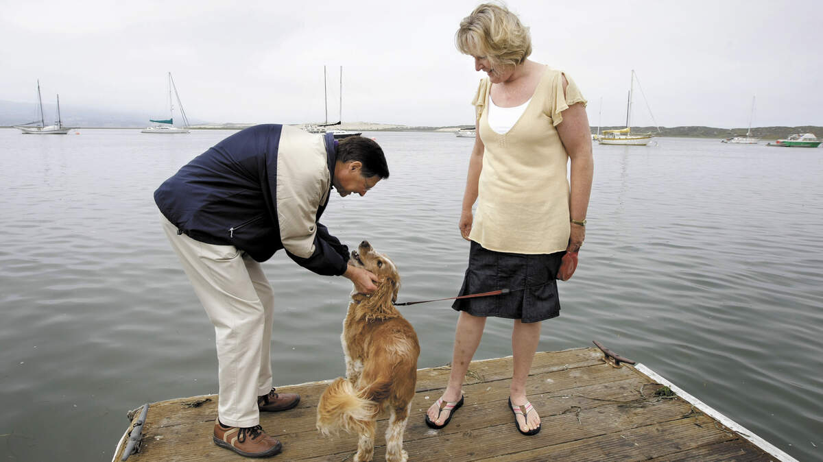 Ed and Susan Cox with their dog Bailey near their home in Morro Bay.
Photo by Joe Johnston 7-23-08