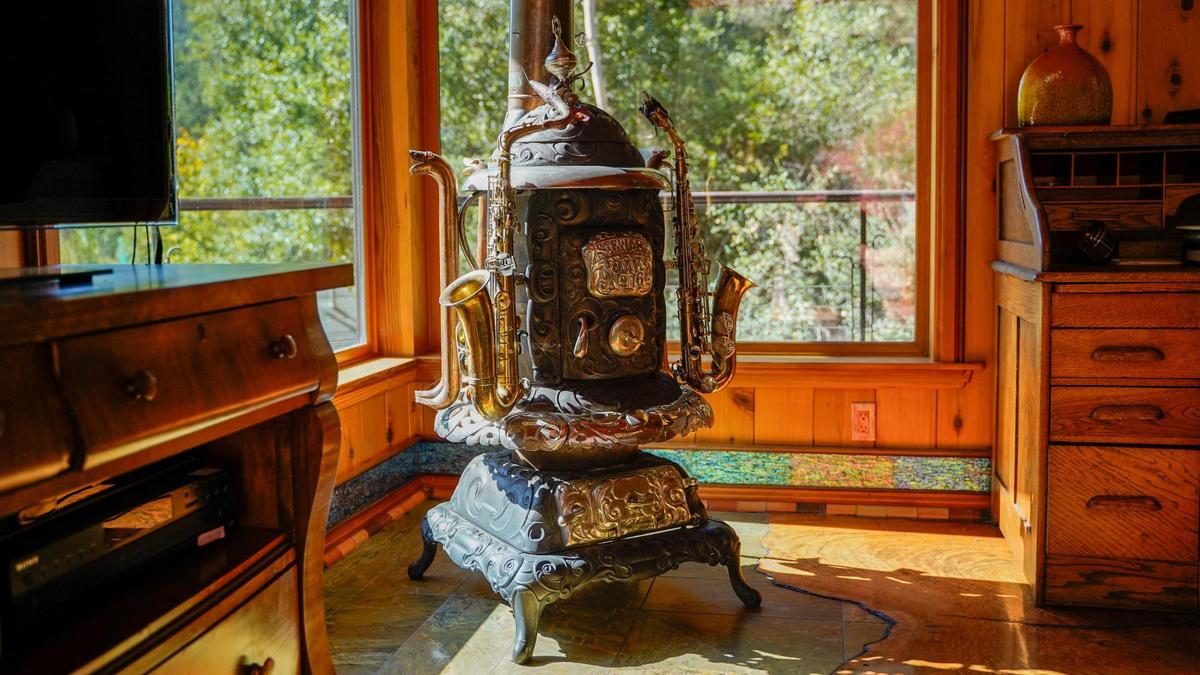 Longtime former San Luis Obispo County resident Reggie Whibley’s home north of Lopez Lake is a treehouse-like structure built on metal legs painted to resemble trees Tuesday, Oct. 29, 2024. Following Whibley’s death in 2020, the property went up for sale, featuring views of the surrounding canyon, custom woodworking and design and a fully converted Beachcraft airplane parked in the backyard, which serves as the guest lodging.
