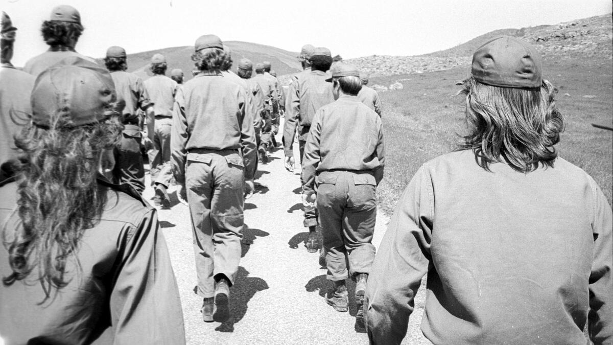 Two female cadets? No, but it’s hard to tell when today’s hair styles tend toward long for both men and women. Cal Poly ROTC cadets train on April 6, 1974.