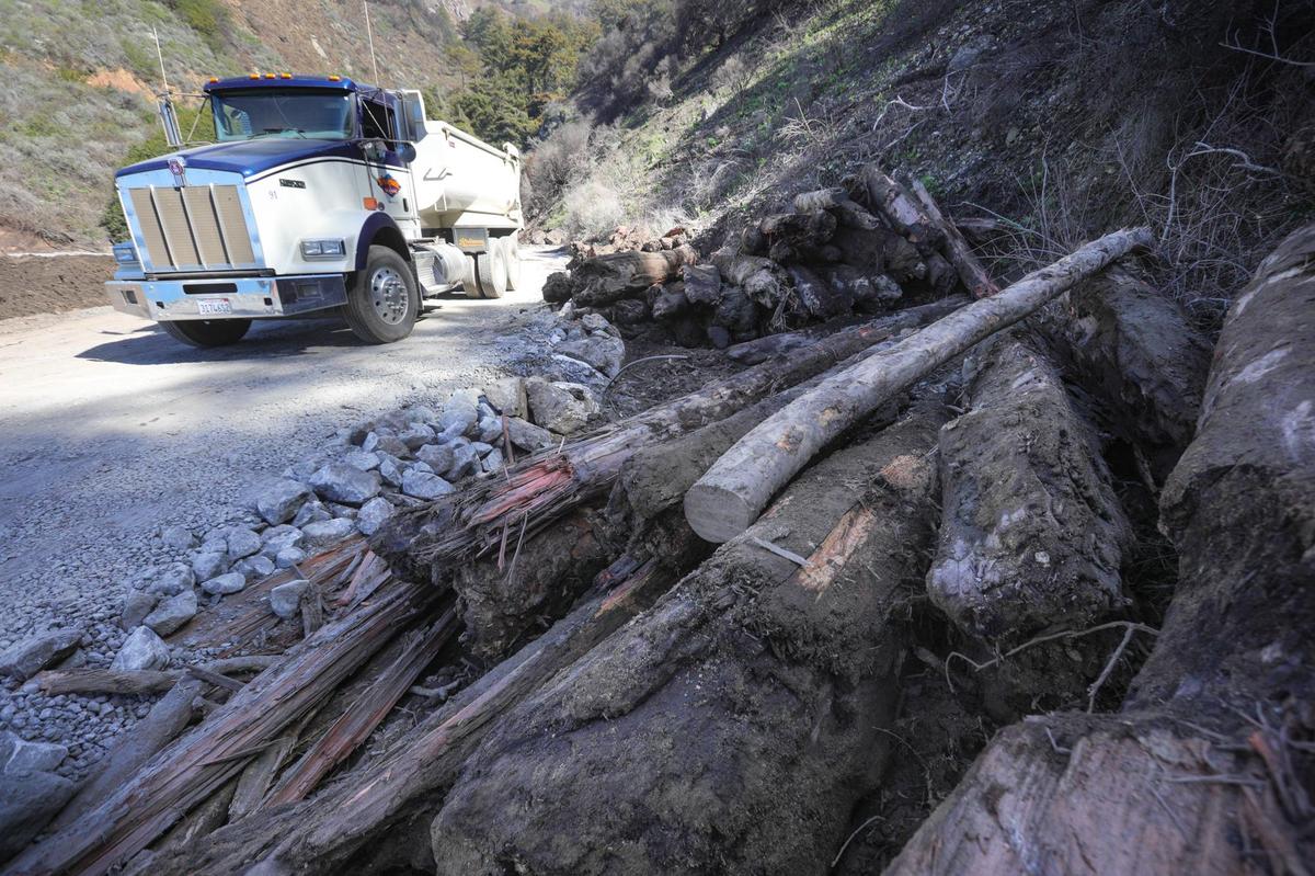 Debris included charred trees from the Dolan fire, washed downstream by an atmospheric river rainfall.