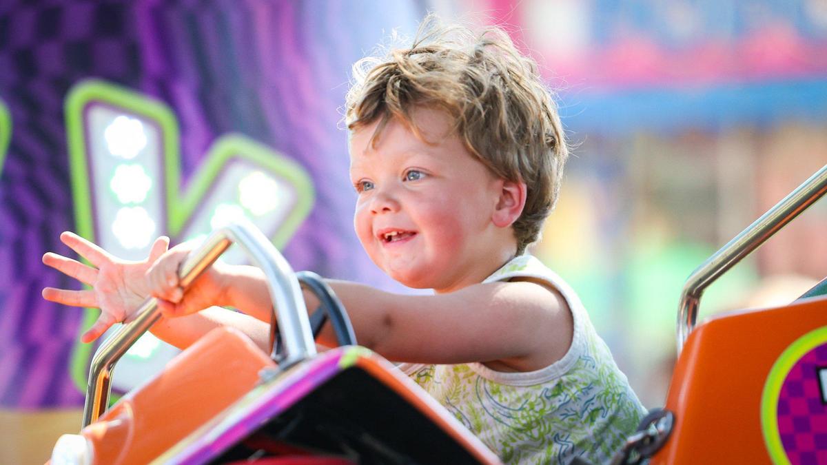 Boden Bean, 2, rides a dune buggy at the California Mid-State Fair, which opened Wednesday, July 19, 2023, in Paso Robles.