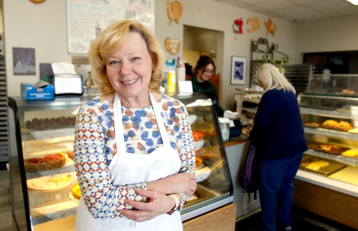 Debra Mouret poses for a quick photo in her busy Morro Bay shop. La Parisienne in Morro Bay is a French bakery is serving up flaky pastries, iced cookies and hearty sandwiches, all at an affordable price for locals and tourists alike.