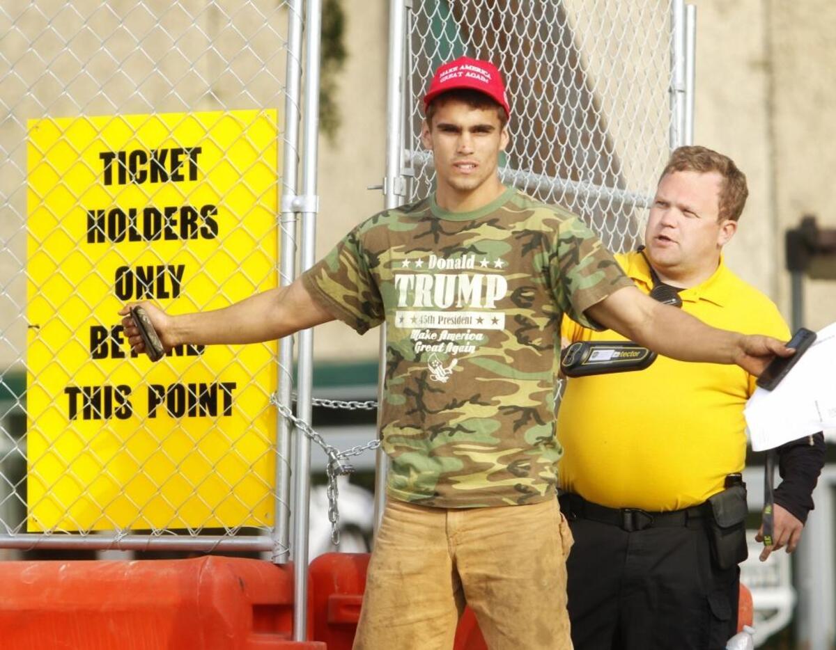 A ticket-holder on his way to a Milo Yiannopoulos event passes through a security gate on Thursday, April 26, 2018.