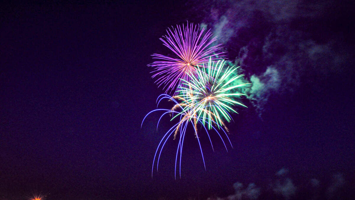 Fireworks burst under the coastal marine layer during a Fourth of July celebration in Cayucos. The depth of the marine layer can dramatically influence the viewing experience along California’s Central Coast.