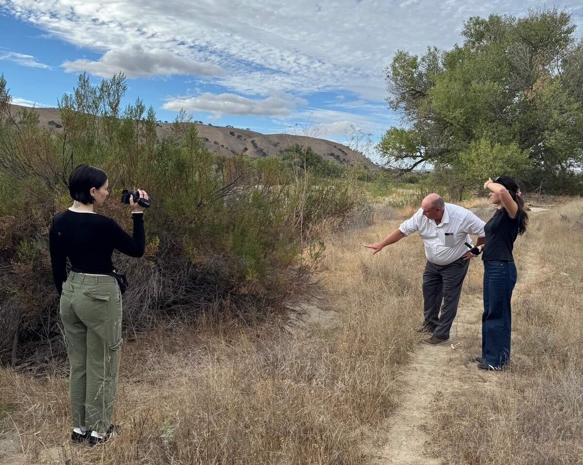 San Luis Obispo County Sheriff’s Office Detective Clint Cole shows “Crime Junkie” podcast hosts crime scenes of the 1980 cold case double murder of 4-year-old Martha Mezo and 5-year-old Teresa Flores. A Nov. 10, 2025, episode of the podcast reports on the reopened investigation, led by Cole.