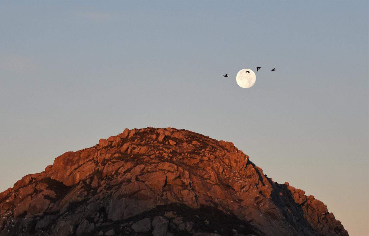 A “moonset” over Bishop Peak in San Luis Obispo on the morning after the winter solstice on Dec. 21.