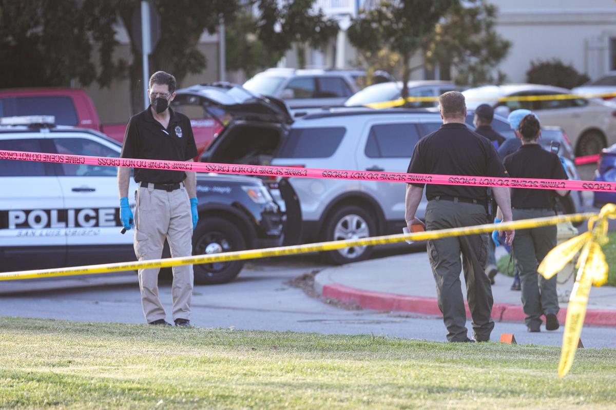 Police and sheriff’s deputies mark evidence on Margarita Avenue after a shooting May 10 in San Luis Obispo that resulted in the deaths of Eddie Giron, a suspect in commercial burglaries, and SLOPD Officer Luca Benedetti. Giron’s family has filed a claim, citing police misconduct and his wrongful death.