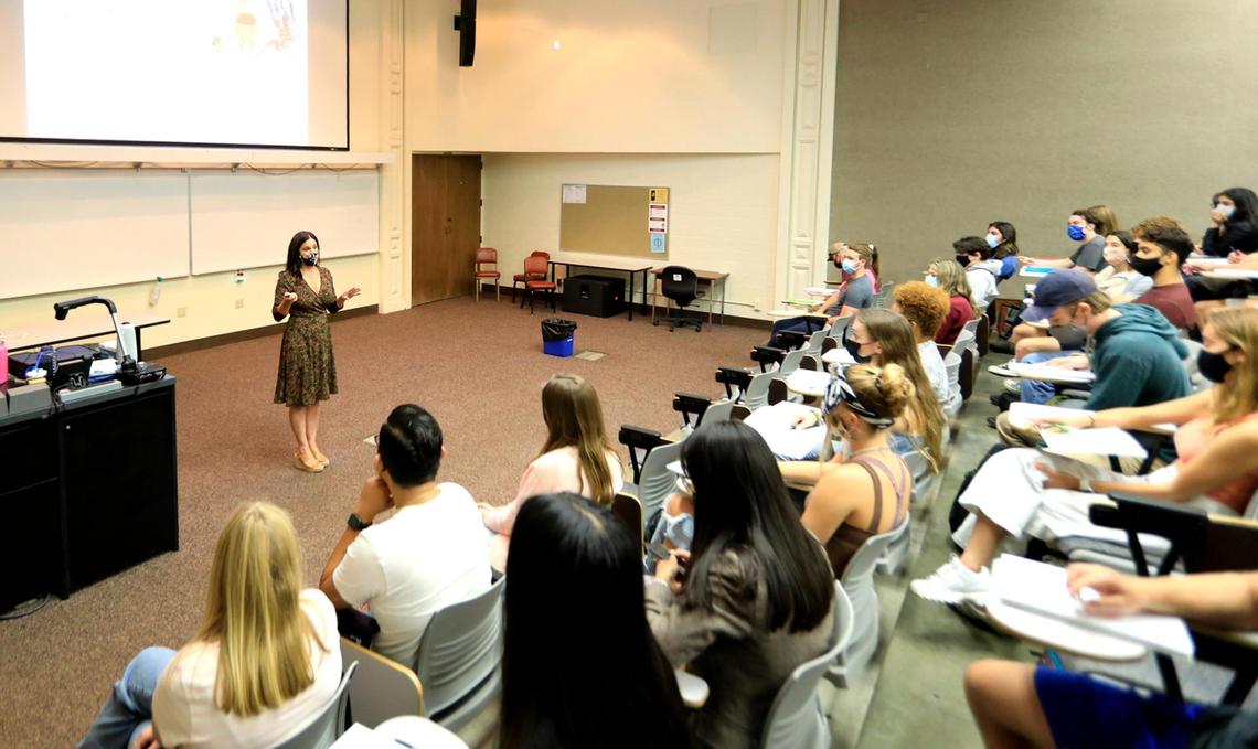 Katy Dittmer, a psychology teacher speaking at the head of a roomful of students. Thousands of students returned to in-person classes at Cuesta College this week.