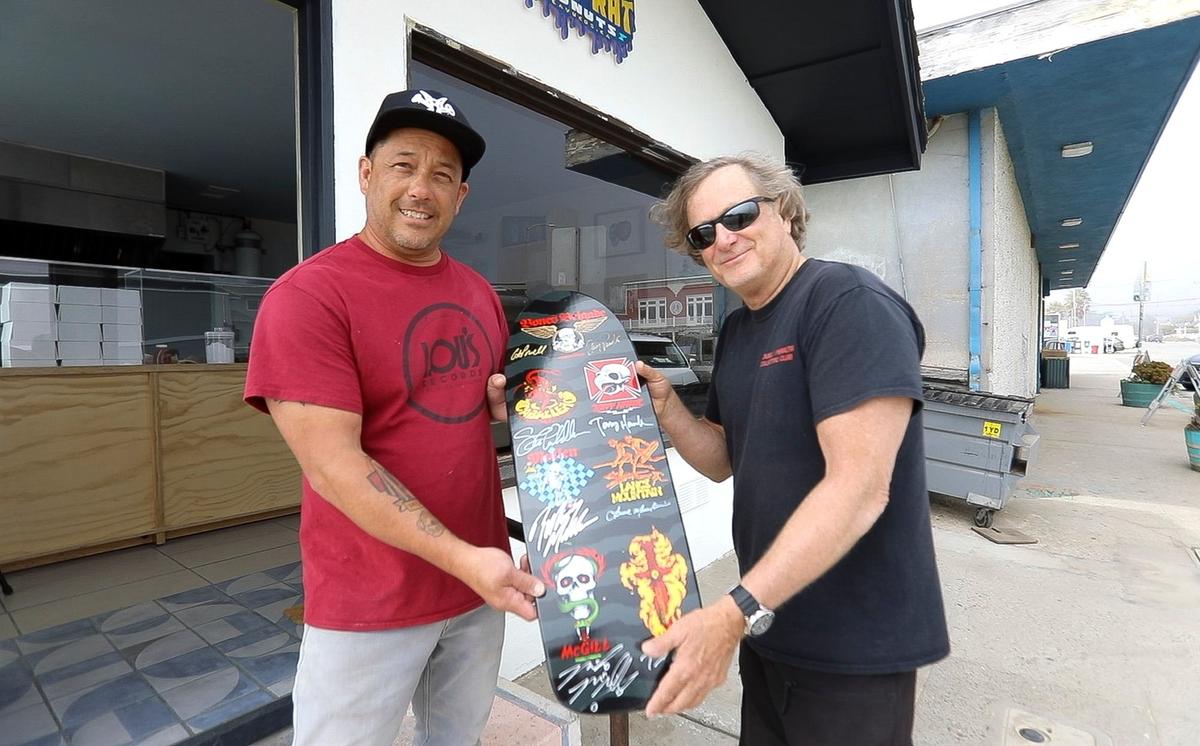 Ben and Jessica Brown acquired a shuttered former fish smokehouse in Cayucos and transformed it into a new, eye-catching doughnut shop, Surf Rats Donuts. Ben Brown’s friend, skateboard legend Stacy Peralta, brought by a skateboard deck for hanging on the shop’s wall, where some of Peralta’s artwork hangs.