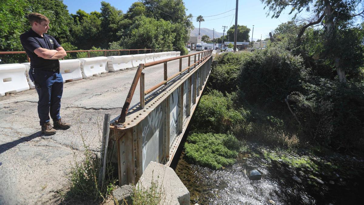 The city will add bypass channels and replace the Bianchi Bridge so San Luis Obispo Creek can hold more water during flood events. City engineer Noah Maidrand lead a tour of the project area on Aug. 14, 2024.