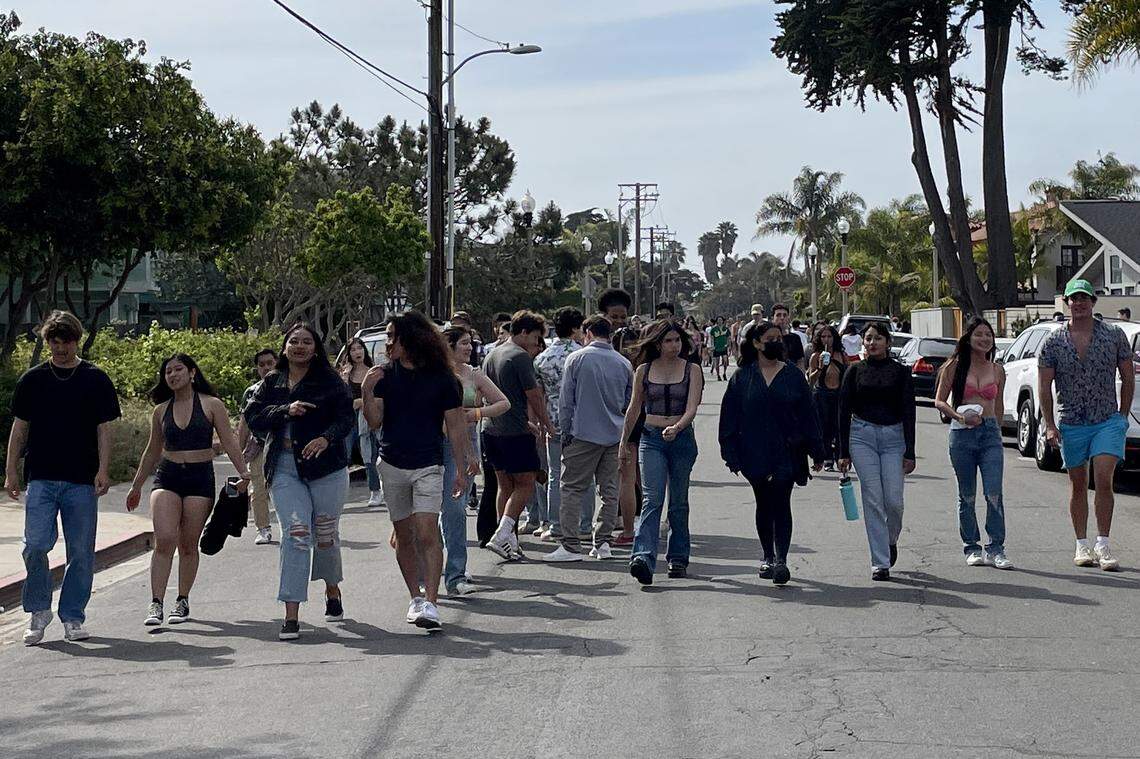 The annual unsanctioned street party known as Deltopia draws crowds of college students to Del Playa Drive in Isla Vista on Saturday.