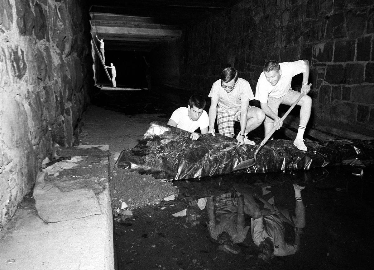 Cal Poly students prepare for a dance, the “Sewer Stomp” in San Luis Creek under town June 15, 1966.