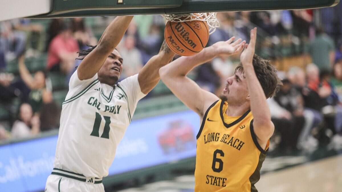 Austin Goode scores over Petar Majstorovic.Cal Poly beat Long Beach State102-92 on Feb. 26, 2026.