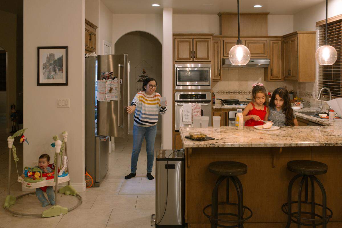Susana Lopez makes dinner with her family on Saturday, Dec. 18, 2021, in Paso Robles. Knowing that her three daughters may also struggle to feel they belong in their own community, Lopez joined Paso Robles’ diversity and equity committee.