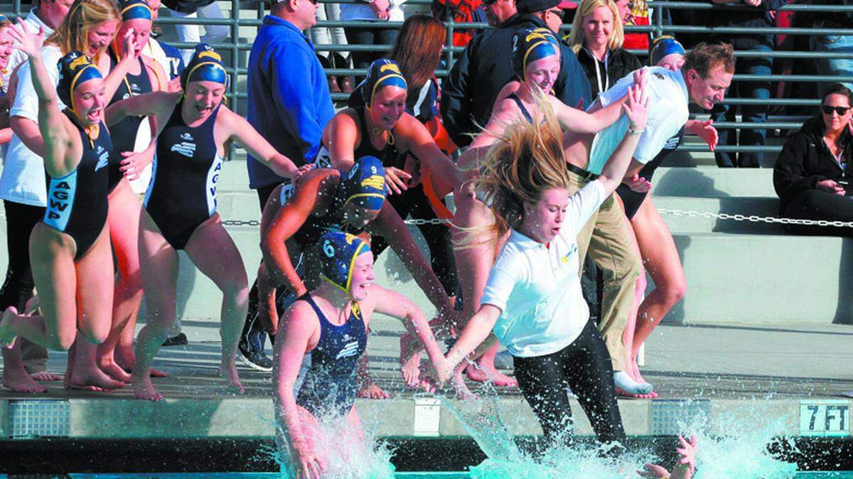 The Arroyo Grande High girls water polo team celebrates its 6-4 win over Riverside Martin Luther King to win the CIF-Southern Section Division 3 championship Saturday afternoon in Irvine.