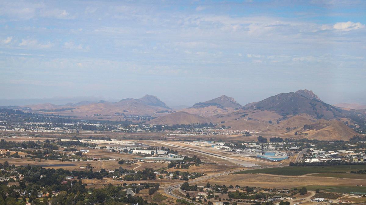 The Morros, including Hollister Peak, Cerro Romauldo, Bishop Peak and Cerro San Luis, rise in the distance behind the San Luis Obispo County Regional Airport. The Northern Chumash Tribal Council organized an aerial tour of lands bordering the Chumash Heritage National Marine Sanctuary on Sept. 18, 2024. The flight was sponsored by EcoFlight, a nonprofit dedicated to appreciation of the environment.