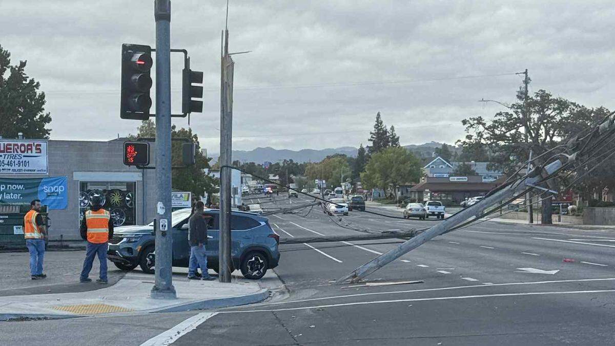 Utility poles and lines were toppled and scattered in the street on El Camino Real in Atascadero on Oct. 27, 2025, closing down the city’s main drag to traffic.