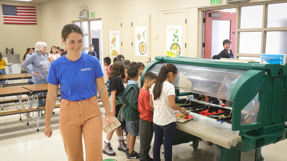 Lauren Thomas, food and nutrition services director at San Miguel Joint Unified School District, supervises lunch at at Lillian Larsen Elementary in San Miguel on Aug. 22, 2022.