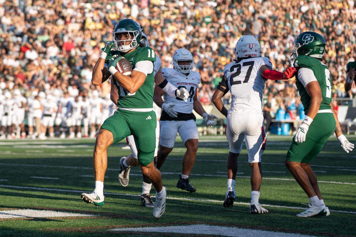 Cal Poly wide reciever Savion Taylor runs in a touchdown in the first half against Western Oregon on Saturday, Sept. 13, 2025. The Mustangs defeated the Wolves in a 56-7 rout at home.