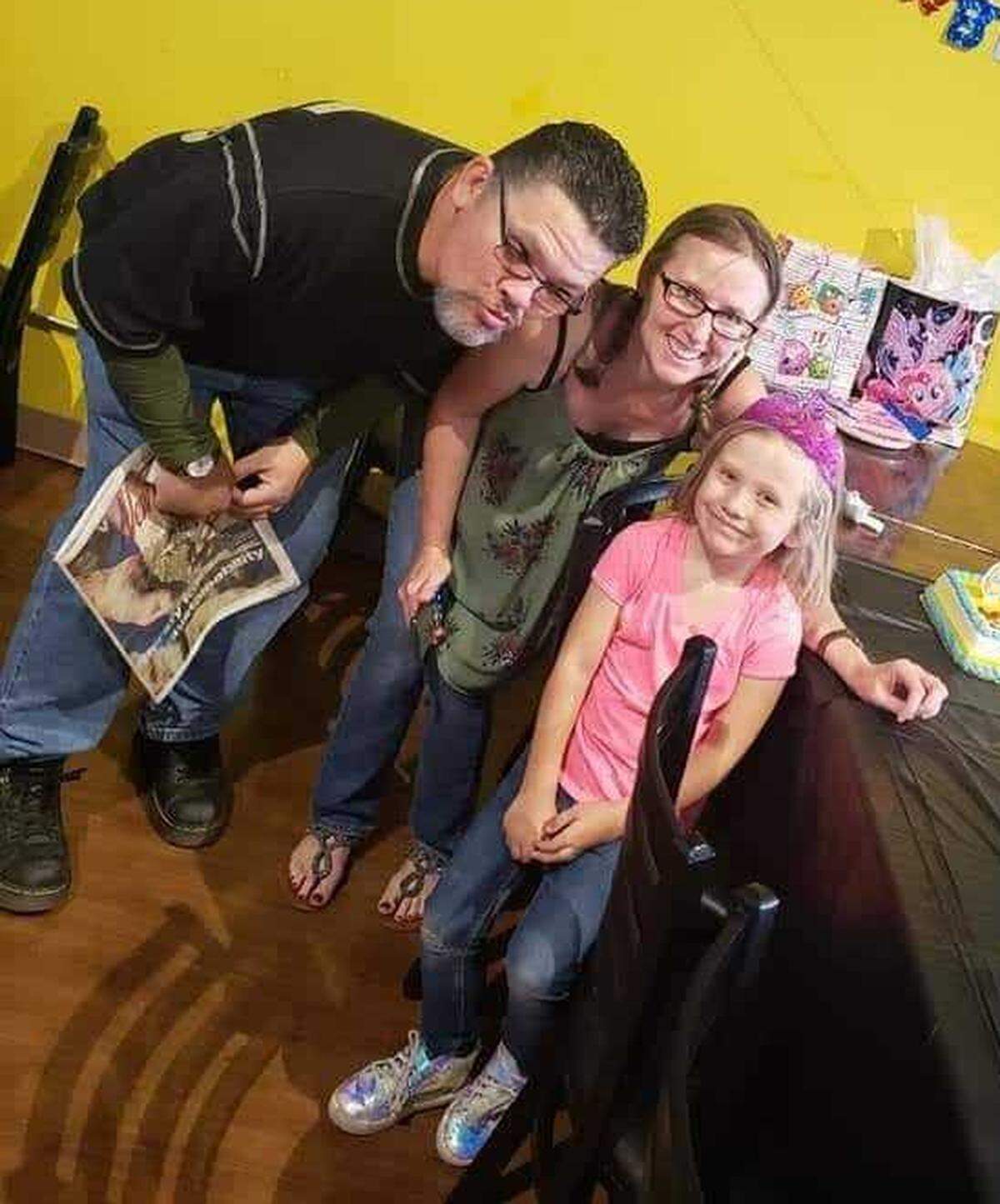 Billy Buchanan mugs for the camera with his wife Kelly Buchanan at a birthday party for their granddaughter, Emma Buchanan.
