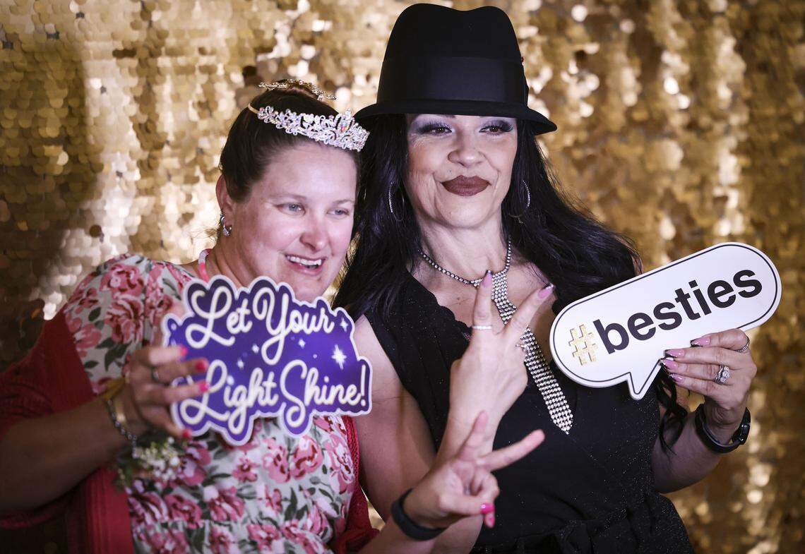Elizabeth Hall, left, poses with Linda Gutierrez at a photo booth at The Let Your Light Shine Special Education Prom held at Atascadero Lake Park Pavilion on Jan. 23, 2026. It was for special needs individuals from the county, their friends and family.