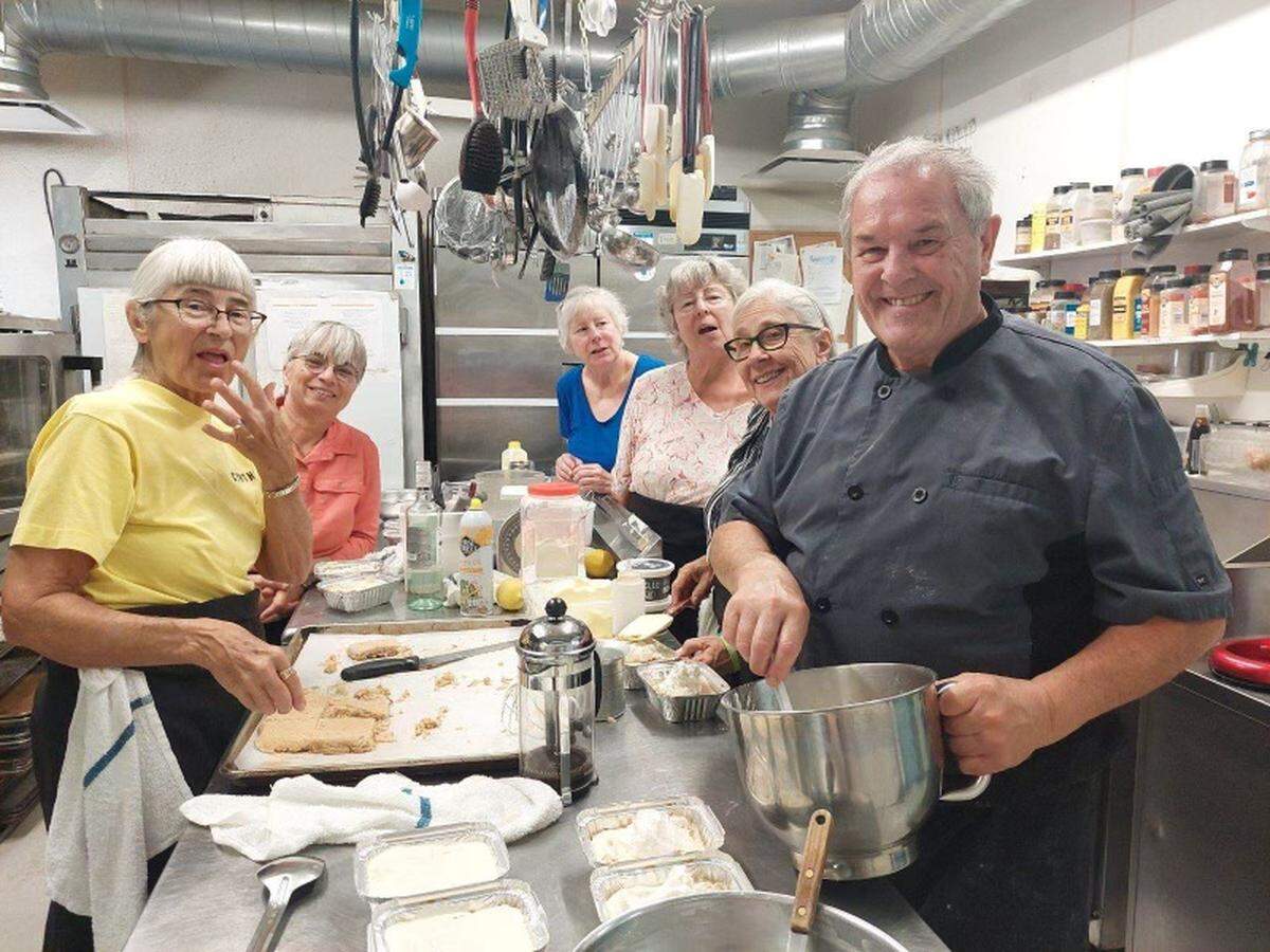Andre Averseng, co-owner of Paso Terra, leads a cooking class on how to make tiramisu. The restaurant closed in March 2025 and is up for sale.