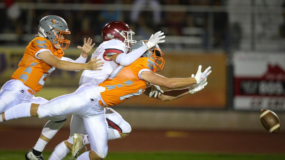 From left, Andrew Allen, Dallas Parish, Tyler Bukamier attempt to catch a pass. In the annual rivalry game, Paso Robles beat Atascadero 35-21 on Sept. 2, 2022.
