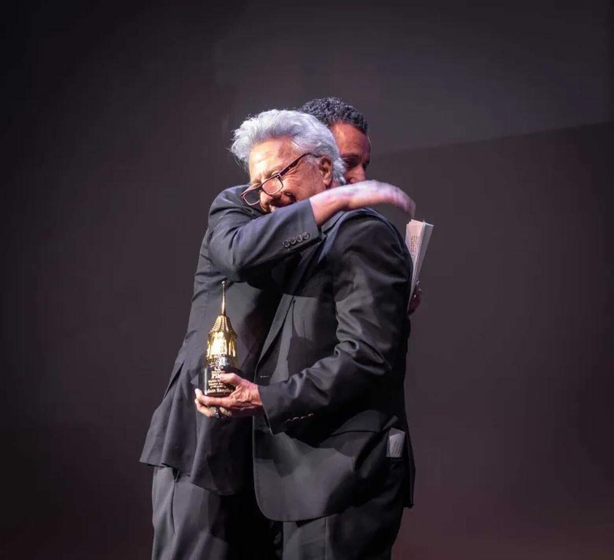 Actor Adam Sandler accepts the Maltin Modern Master Award from Dustin Hoffman at the Santa Barbara International Film Festival Thursday night, Feb. 5, 2026.