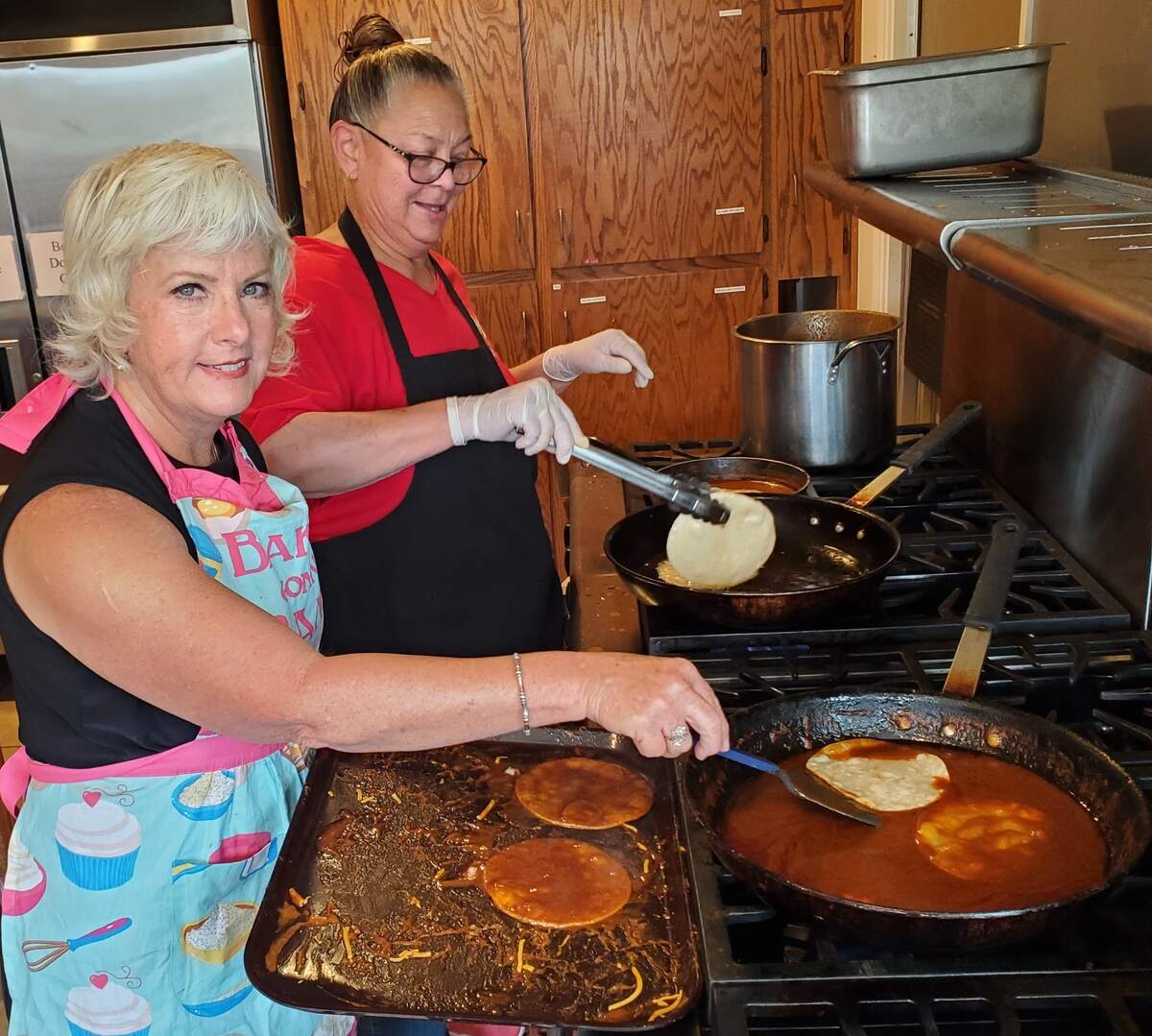 Cambria’s 2026 Citizen of the Year Tala Romero, right, helps a volunteer group prepare enchiladas for the annual sale benefiting El Pinal Parlor No. 163 Native Daughters of the Golden West sale. She’s alongside Debby Boutros. Romero is the co-chairperson for the event, sharing those duties with Consuelo Macedo, a former Citizen of the Year for the small San Luis Obispo coastal community.