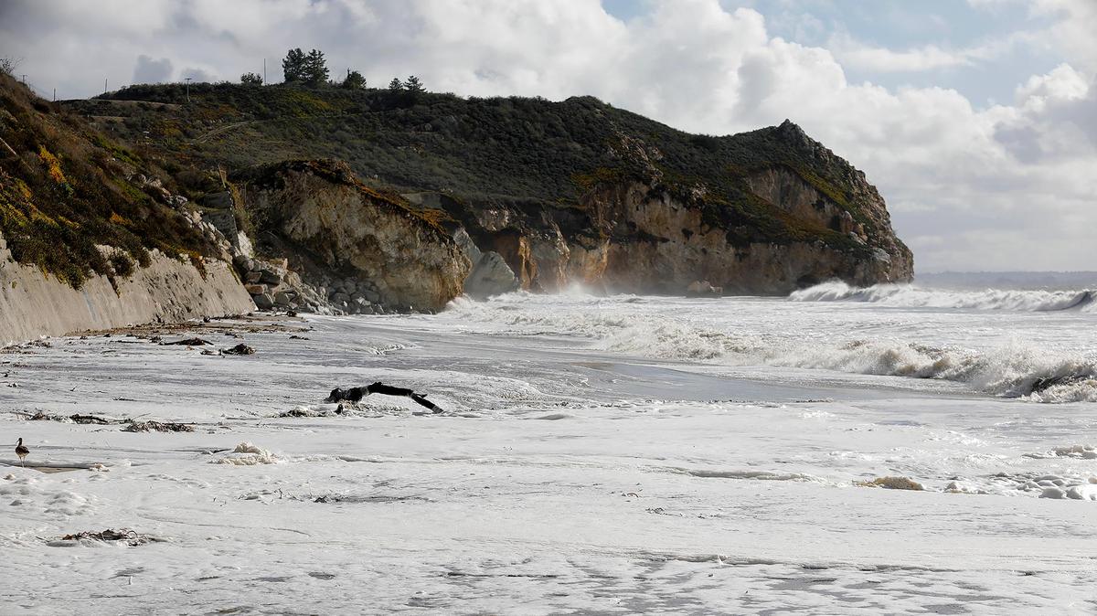 Large, foamy waves can be seen in Avila Beach on Sunday, Dec. 11, 2022, following a powerful storm. The San Luis Obispo County Public Health Department closed part of the beach on Jan. 1, 2023, due to a sewage spill.