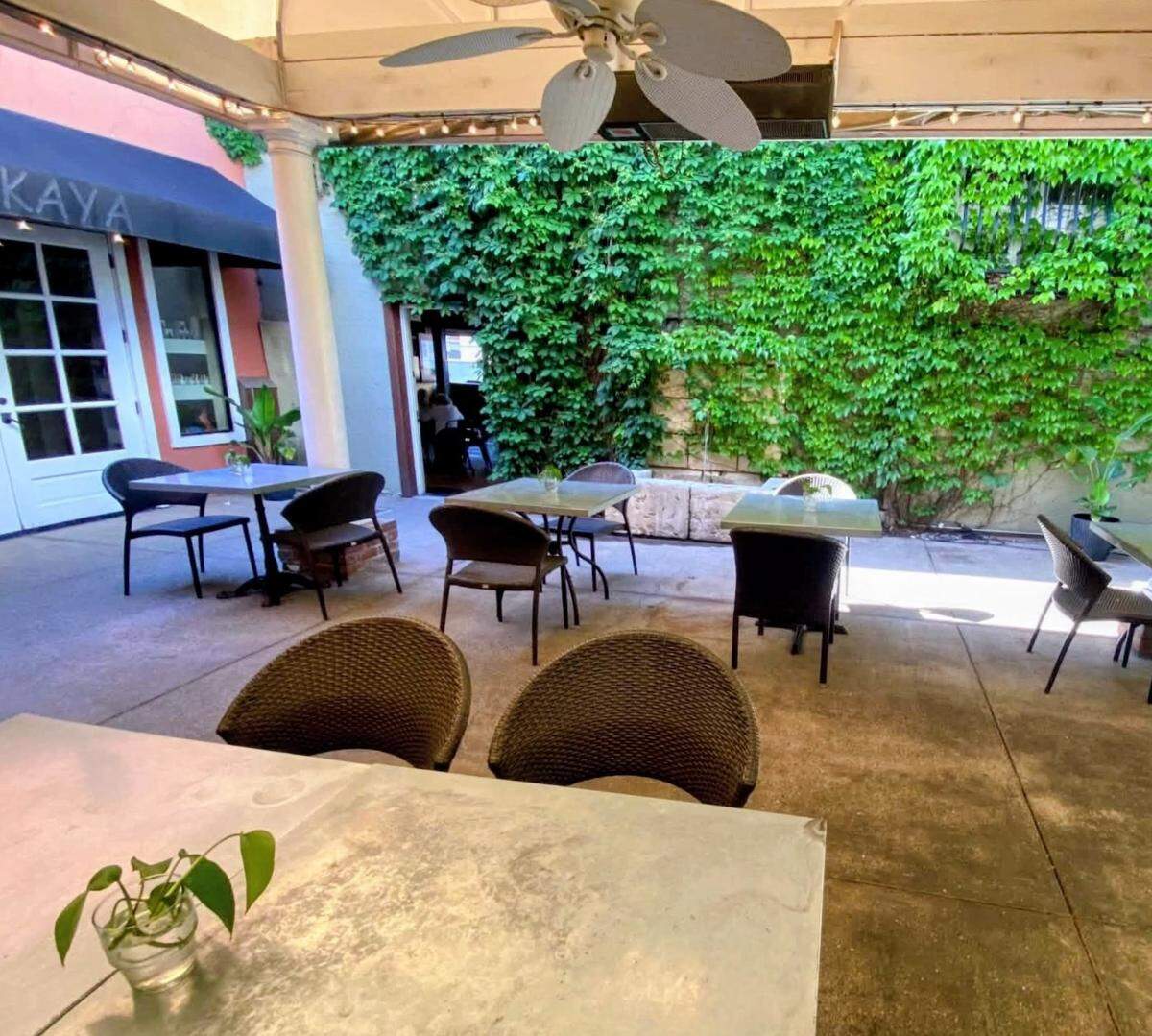 The ivy-lined courtyard at AMSTRDM Coffee House in Paso Robles offers outdoor seating tucked behind the downtown storefront on 13th Street.