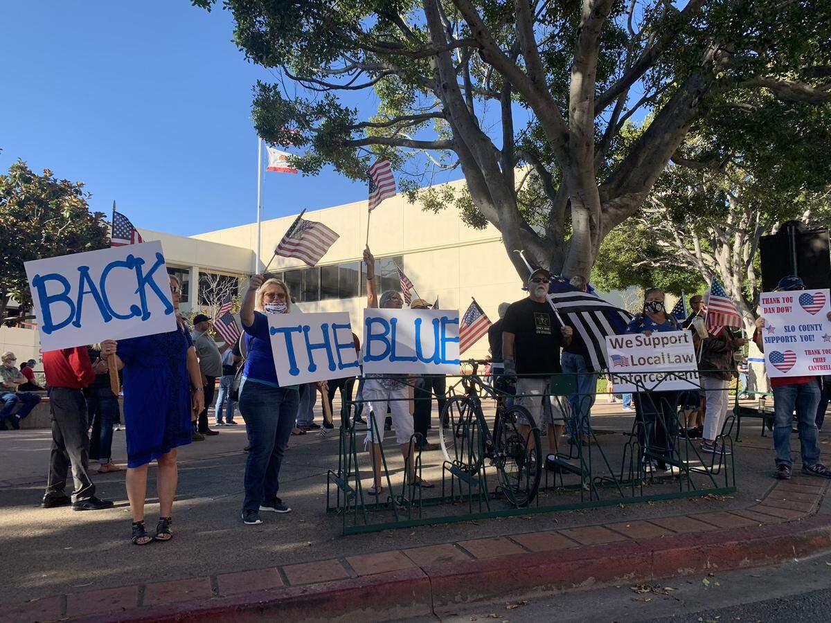 Protesters rally on Monterey Street in San Luis Obispo in support of District Attorney Dan Dow and Central Coast law enforcement agencies.