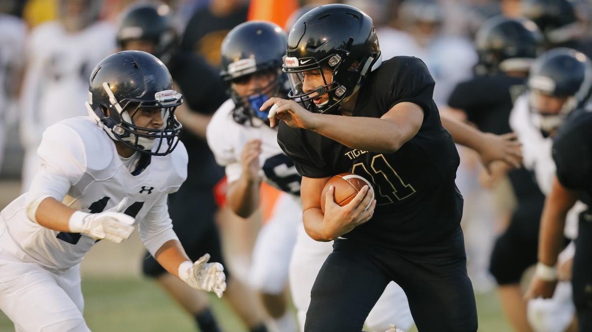 San Luis Obispo High School’s Emilio Corona carries the ball in a non-conference game Friday against Arroyo Grande.