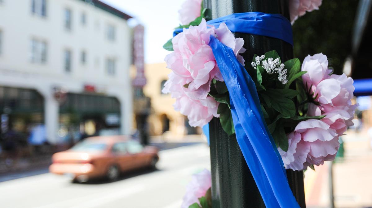 Blue memorial ribbons line Higuera Street in San Luis Obispo in honor of police Det. Luca Benedetti, who was killed in a shootout with suspect Edward Giron, who opened fire on officers as they tried to serve a search warrant on Monday, May 10, 2021. Memorial events will be hedl