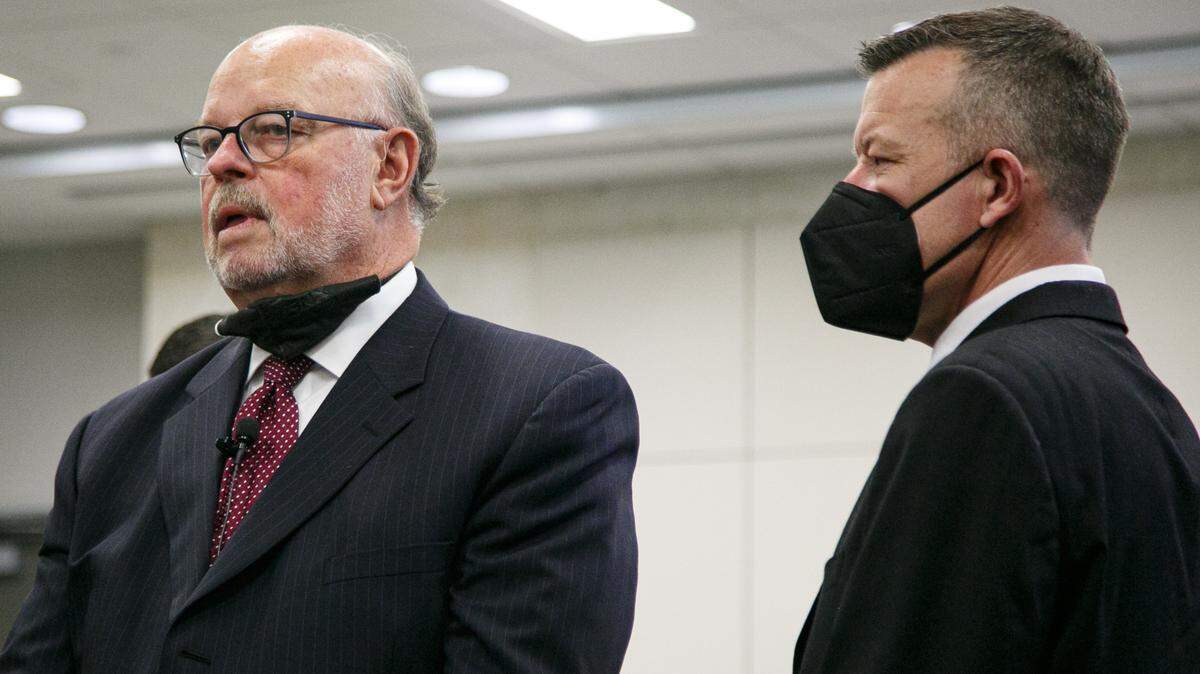 Defense attorney Robert Sanger, left, talks to his client, Paul Flores, in Monterey County Superior Court in Salinas.