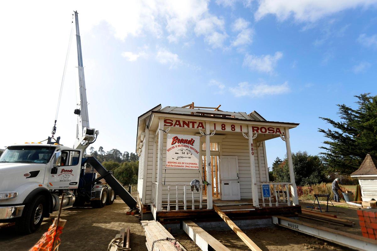 The school house before the old roof is replaced. Cambria Historical Society’s Old Santa Rosa Schoolhouse was moved to a meadow on Main Street at Santa Rosa Creek Rd. A large crane was used by Brandt House and Building Movers to gingerly place the roof back on.