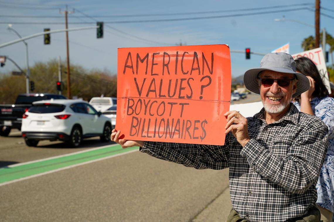 San Luis Obispo resident Don Gerbacht holds a sign during a protest on Los Osos Valley Road on Monday, Feb. 17, 2025. Gerbacht said it was the duty of everyday Americans to oppose Donald Trump’s second term in office.