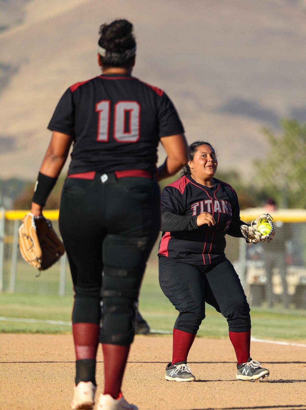 C.J. Arias smiles after catching a pop fly while looking at pitcher Key-annah Pu’a. After trailing all game, the Nipomo Titans beat the Fallbrook Warriors 9-8 in the first round of the Division V CIF Southern California Softball Championships.