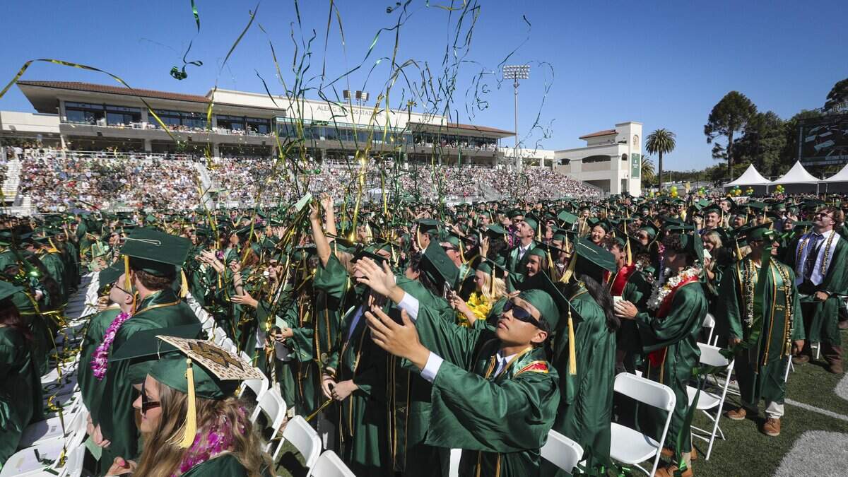 Green and gold streamers fly as students prepare to walk up and have their names read. Cal Poly held the first of six graduation ceremonies at Spanos Stadium on June 13, 2026. The College of Agriculture, Food and Environmental Science held the first ceremony.