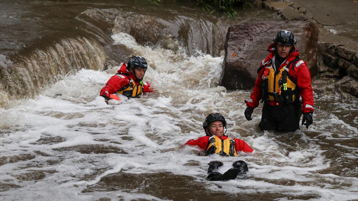San Luis Obispo city firefighters Travis Robertson, left, Dusty Renner and Armando Gutierrez practice water rescue maneuvers in San Luis Obispo Creek on Wednesday, Dec. 20, 2023, as part of their Urban Search and Rescue training.