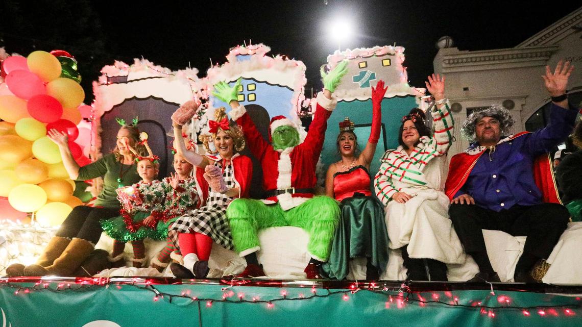 The Grinch waved to the crowd from a Sutter Health float. Unseasonably warm weather encouraged a large crowd to attend the 48th annual downtown Holiday Parade on Dec. 6, 2024.