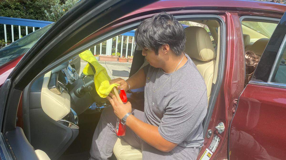 Bronco senior football player Adair Ponce details a vehicle on Sunday, August 20, 2023, in Cambria.