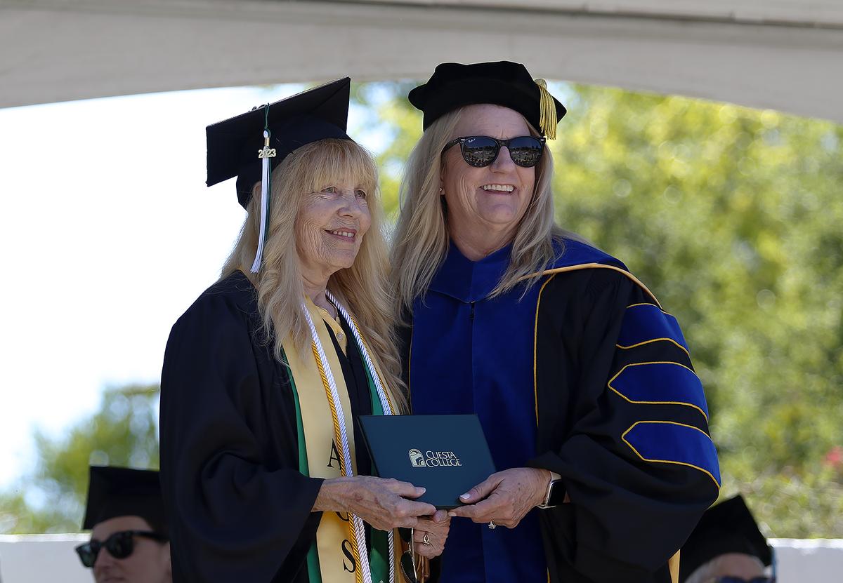 Romi West, 71, of Cambria, graduated with a liberal arts degree from Cuesta College on Friday, May 19, 2023. “This graduation is extra special to me because I’m honoring my husband and sister who both passed away recently,” West said through tears. Cuesta College Superintendent Dr. Jill Stearns handed out diplomas.