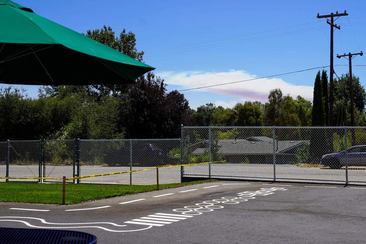 The Gifford Fire looms in the distance, seen here from Santa Margarita Elementary School on Wednesday, Aug. 13, 2025.