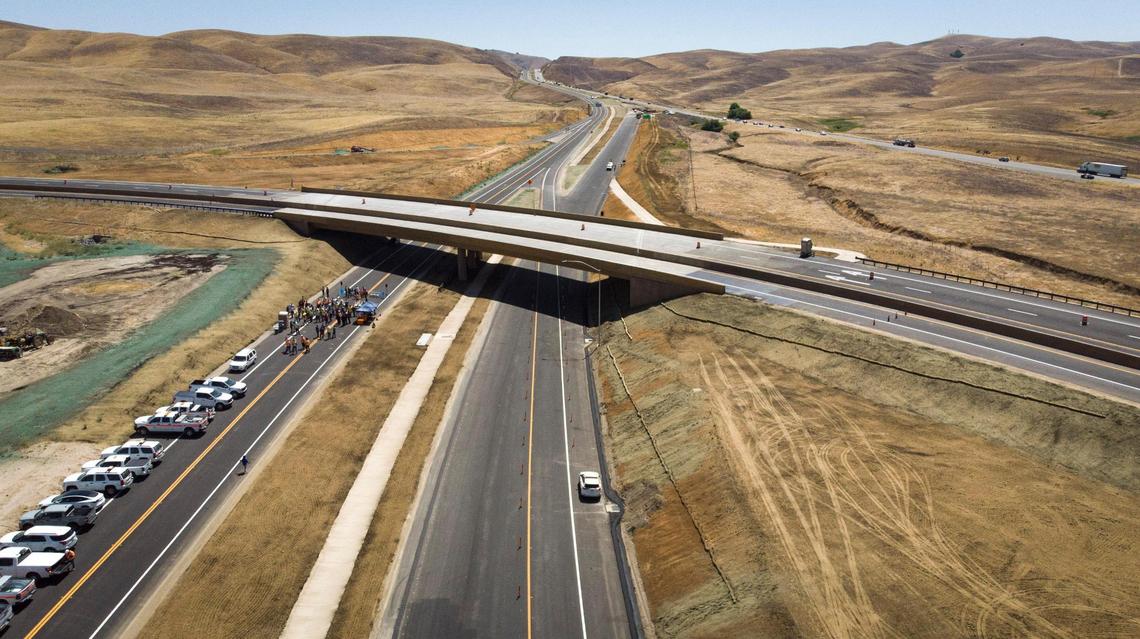 Caltrans District 5 and the San Luis Obispo Council of Governments (SLOCOG) gathered at the new Highway 41/46 flyover interchange on June 11, 2025, to celebrate completion of the project. Traffic will be rerouted from the current highway, at right, to the new road.