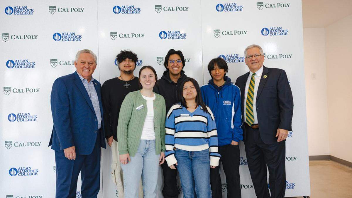 Allan Hancock College President Kevin G. Walthers and Cal Poly President Jeffrey D. Armstrong celebrate the announcement of three new bachelor’s degree options with students at a news conference on March 17, 2025. 