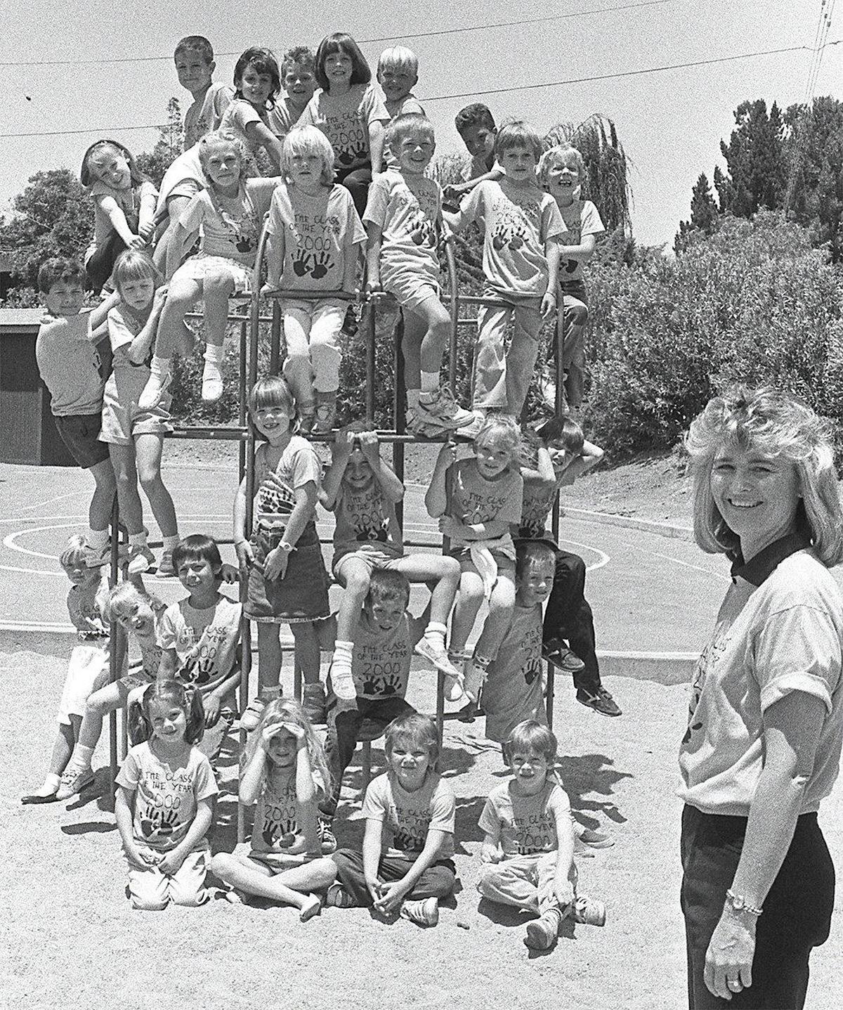 Sue Babcock poses with her Sinsheimer Elementary School Kindergarten class on a metal play structure at the end of the school year, published June 24, 1988. The Telegram-Tribune followed her class to high school graduations as part of the Class of 2000 project.