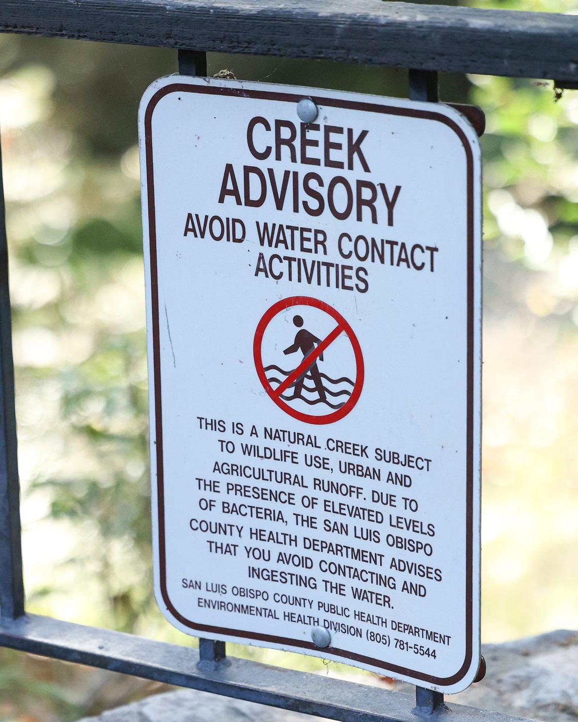 Pigeons living in the San Luis Obispo Creek tunnel contributed to unsafe amounts of E. coli in the water. City biologist Freddy Otte hopes that efforts to lower bacteria levels in the water will one day allow him to remove this sign from the Mission Plaza creek walk area, seen on Oct. 28, 2024.