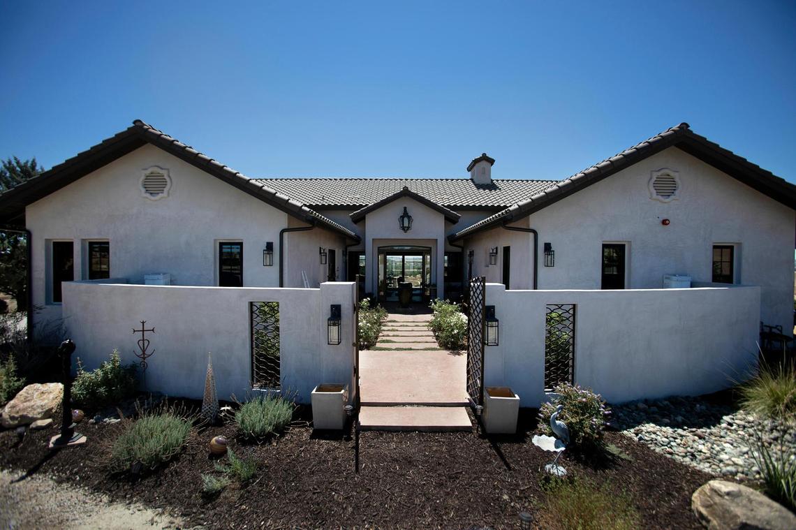 The San Miguel home of Charles Miller and Tina Gulotta-Miller is situated around a center courtyard with a great room reminiscent of a mission hall and two wings.